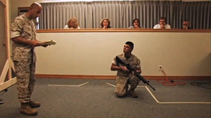 In this image,taken from footage which has not been broadcast before humbertho merdoza (kneeling) explaining what happened 